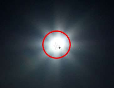 Centering the Elliptical Marquee Tool cursor inside the moon. Image © 2013 Photoshop Essentials.com