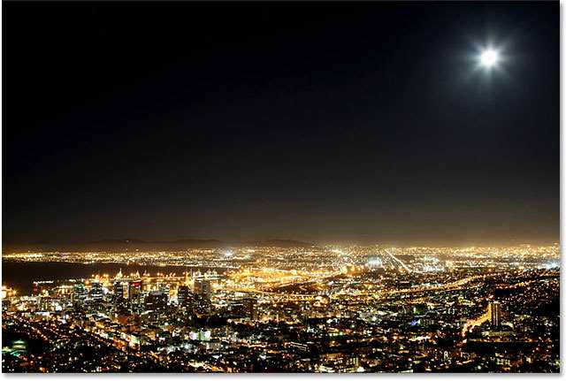 PS快速制作繁星 优图宝网 PS入门实例教程Cape Town harbor and city at night with moon in the sky. Image 59821666 licensed from Shutterstock by Photoshop Essentials.com