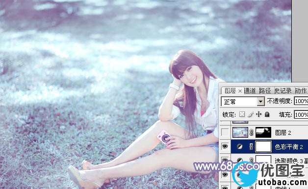Photoshop给绿草中的美女加上梦幻的青色调